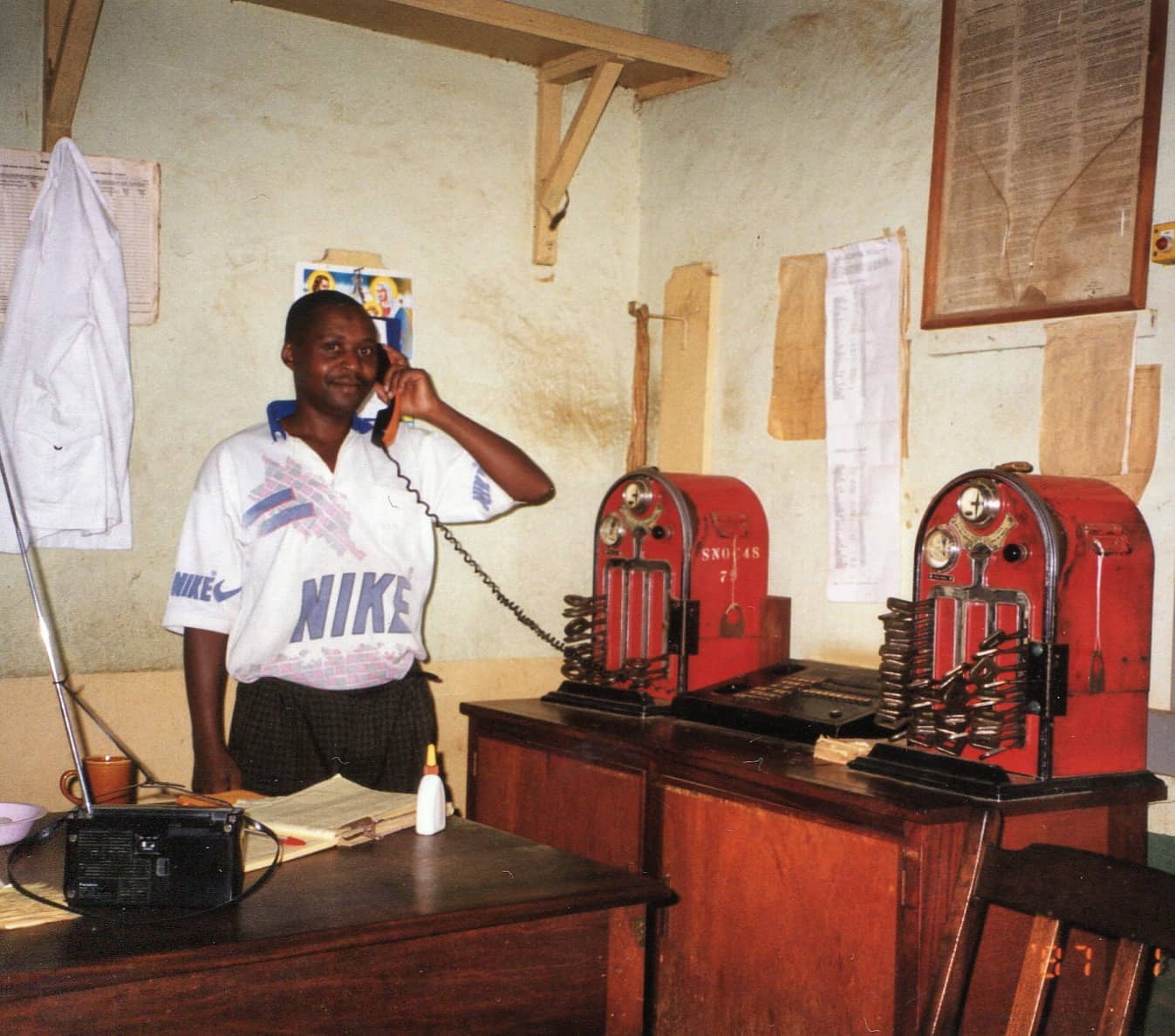 Mr.Mwogi station master, Makindu station 2001.
You'll notice that I have very few photos of people at the various stations. When I first started the project in 2013 my intention was to photograph the stations and interview people who worked in them along the way.
But as they say "kwa ground vitu ni different". The reality was that most stations had already been shut down by 2015 so it was incredibly rare to find any railway staff members.
This is largely why I still feel that this project is incomplete, because the memories and experiences of ordinary Kenyans have been erased and forgotten in favour of political, nationalistic histories.
So thank you to Mr.Mwogi wherever you are, we may not have met but your work is appreciated by many.
Photo by Terry Barton, 2001
