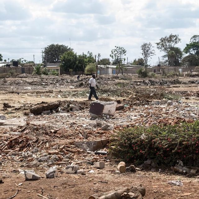 A man walks across the ruins of Sultan Hamud station. This picture was taken in August 2015. The station had been demolished a couple of days before we got there to pave way for the SGR.