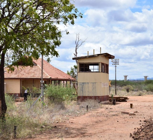 Looking at it, you can't tell that this is probably the most famous station in the entire history of the railway. Infamously associated with the Man Eating Lions of Tsavo, Tsavo station is a small structure with a big name.
By this time in October 2015, the station was barely functioning, only one or two staff were present to oversee the occasional cargo train...... But then again, whether today or historically, who for fear of their life would casually alight here? The legend remains.
Notice the SGR piers in the background.
#Tsavo